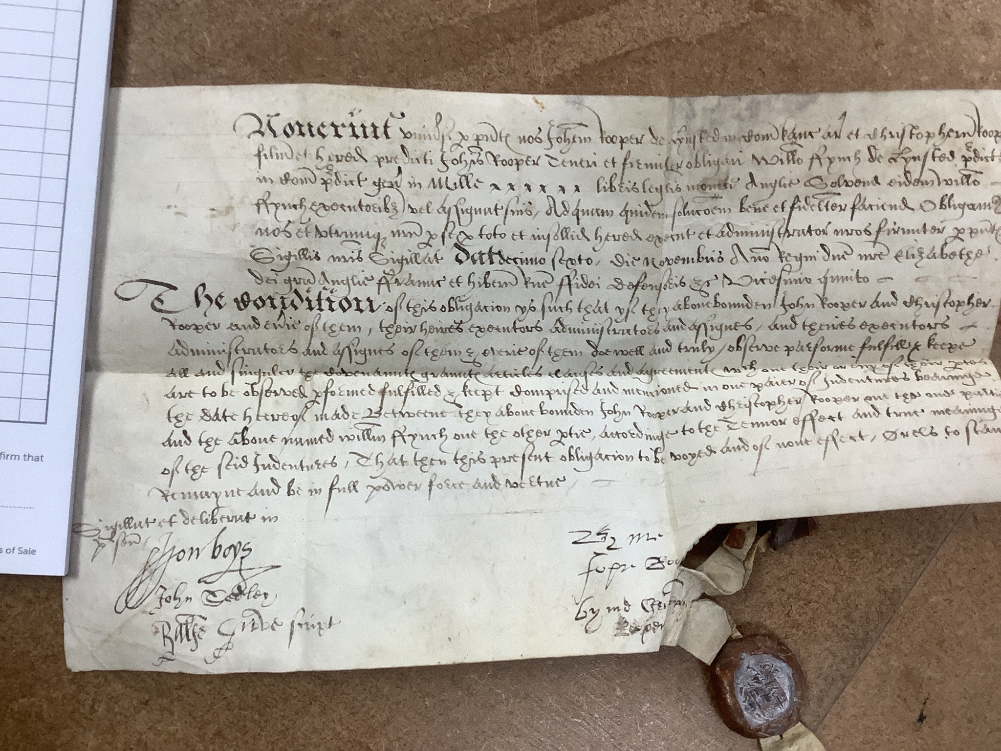 A group of coins, medals including a cartwheel twopence 1797 and an Elizabethan vellum deed